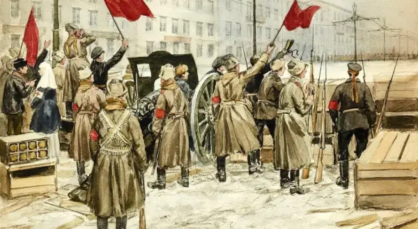 Obraz rewolucji w przedwiośniu: ludzie z czerwonymi flagami, żołnierze z karabinami i armata na ulicy.